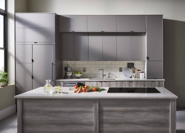 Front view of a modern kitchen with an induction cooktop in an island