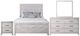 New Classic® Home Furnishings Biscayne 4-Piece Driftwood Eastern King Panel Bedroom Set-0