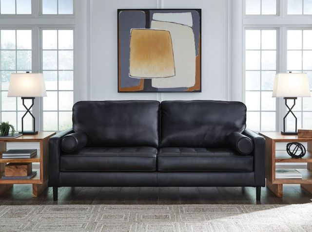 Credit: Signature Design by Ashley Front view a mid-century modern sofa with modern decor