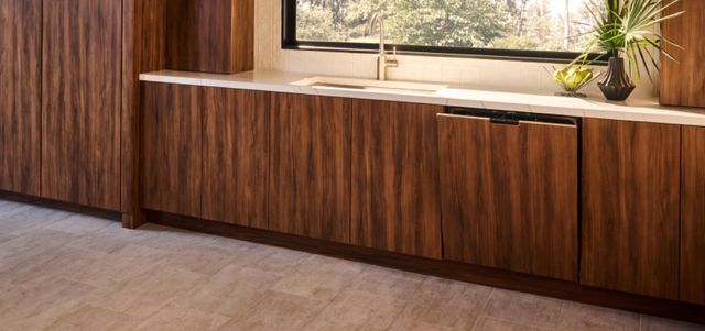 Front view of a luxury kitchen with a panel dishwasher from Dacor Front view of a luxury kitchen with a panel dishwasher from Dacor