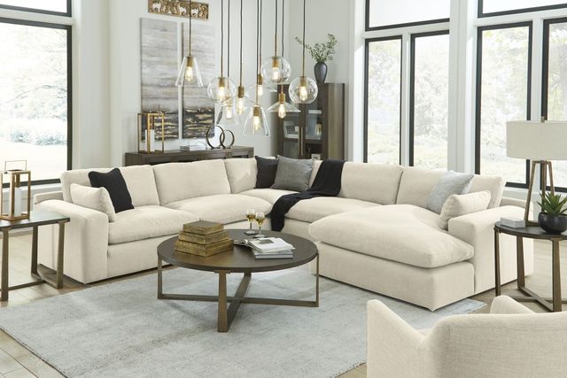 front view of a modern living room with a cream colored deep sectional sofa