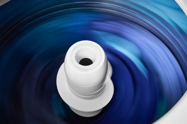 Front view of the inside of a Maytag washer spinning 