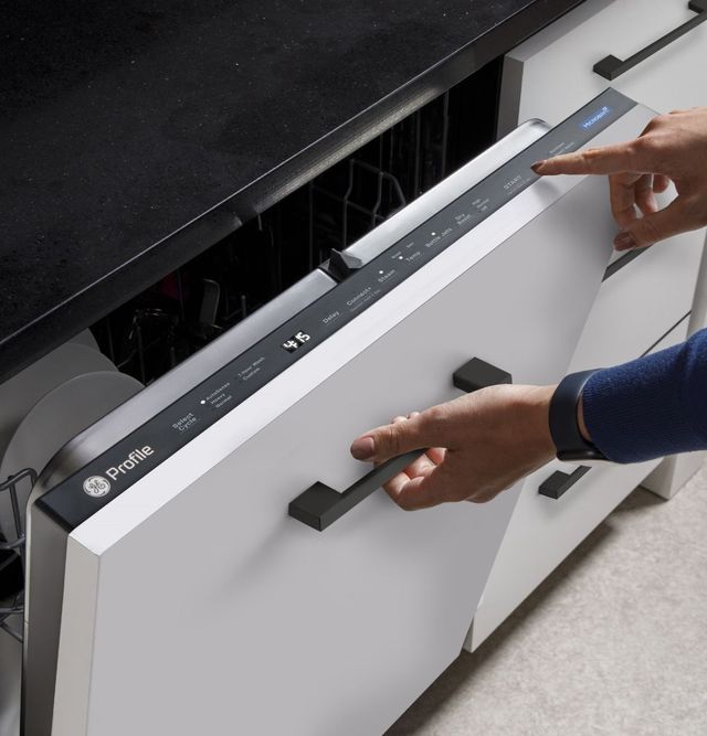 Two dishwashers side by side on a showroom floor Two dishwashers side by side on a showroom floor
