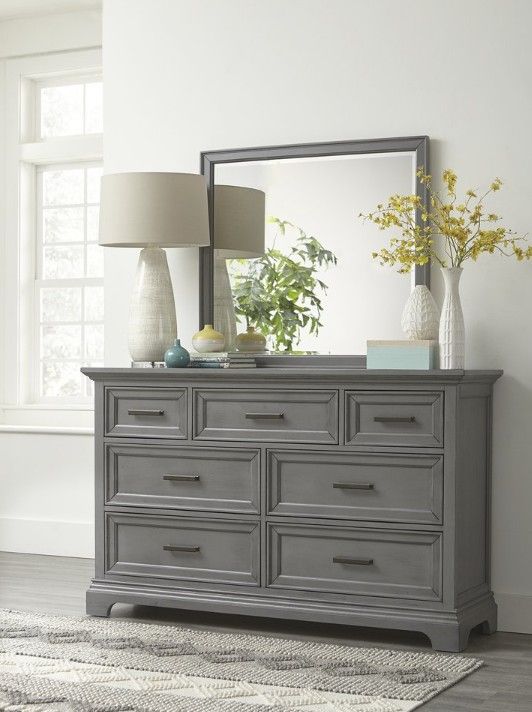 Bedroom with a bed, nightstands, and a dresser Bedroom with a bed, nightstands, and a dresser