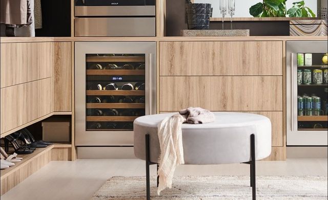 Front view of a closet with a Sub-Zero wine refrigerator 