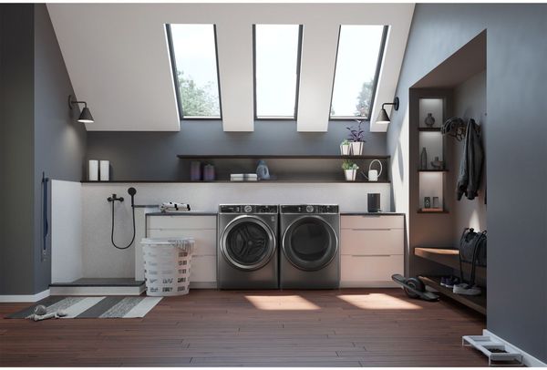 Top Load vs Front Load Washer in modern laundry room Top Load vs Front Load Washer in modern laundry room