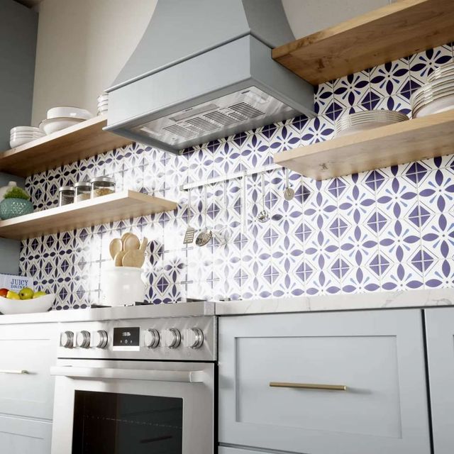 Sleek range hood insert integrated into a wood enclosure