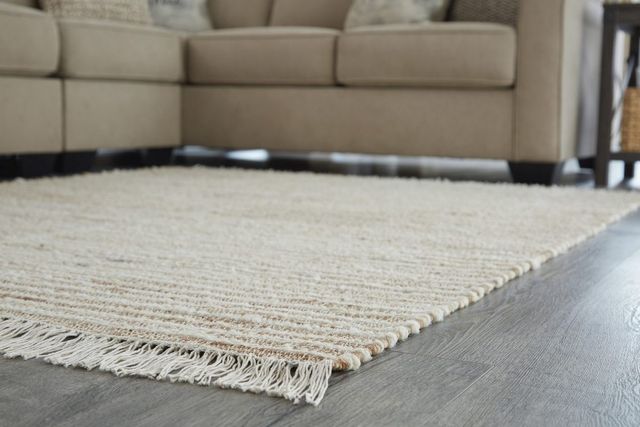 Signature Design by Ashley® Millennium Cream/Natural 5' x 7' Medium Area Rug-1