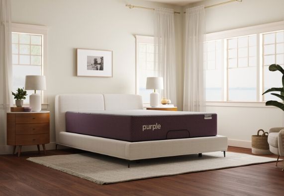 Front view of a modern bedroom with a Purple mattress in a box Front view of a modern bedroom with a Purple mattress in a box