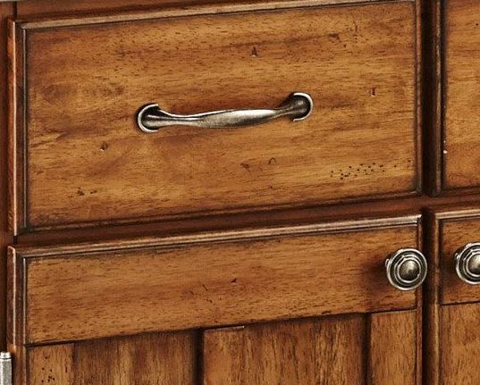 close view of a wooden cabinet and drawer