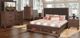 New Classic® Home Furnishings Cagney 4-Piece Chestnut Queen Panel Storage Bedroom Set-0
