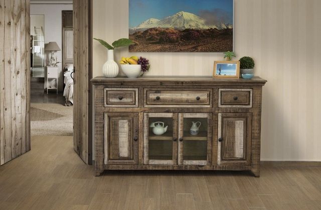 front view of a natural two-tone wooden sideboard next to an open door 
