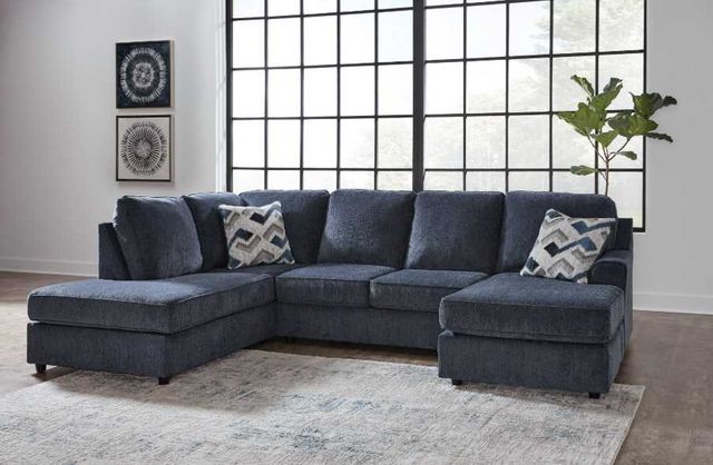 front view of the Signature Design by Ashley® Albar Place 2-Piece Cobalt Sectional in a modern living room
