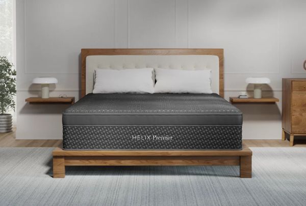 A cross-section illustration showing the internal layers of foam and pocketed coils in a Helix mattress. A cross-section illustration showing the internal layers of foam and pocketed coils in a Helix mattress.