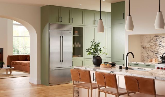 front view of a modern kitchen with a stainless steel sub-zero refrigerator