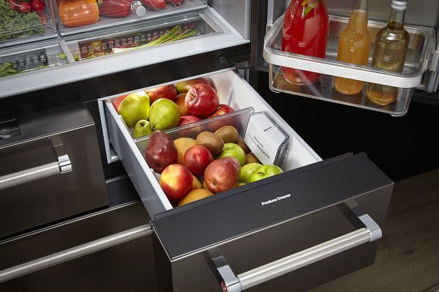 front view of a Kitchenaid black french door refrigerator drawer open and stocked
