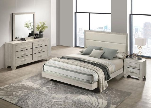 View of a modern white bedroom with a large window wall and a cream full-size bed set.