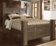 Signature Design by Ashley® Juararo Dark Brown Queen Poster Bed-1