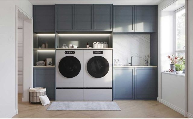 Close up view of professional stacking hardware installed between a washer and dryer