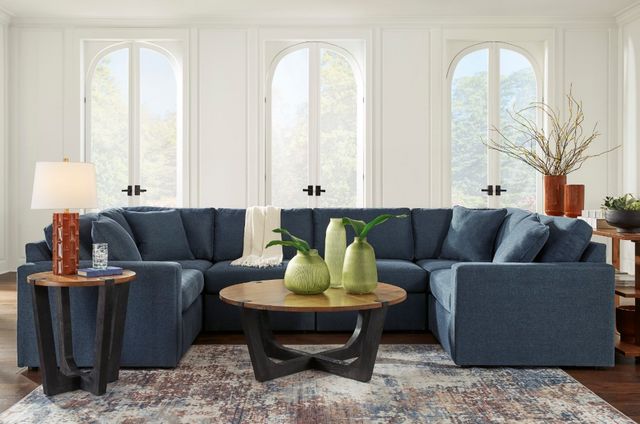 front view of a blue u-shaped sectional in a modern living room