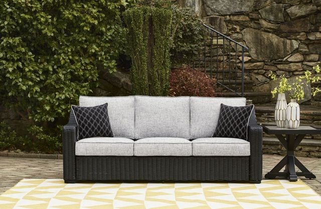 Signature Design by Ashley® Beachcroft Black/Light Gray Fabric/Wicker Outdoor Sofa with Cushion-1