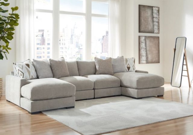 Front view of a modern room with a Benchcraft white U-shaped sectional