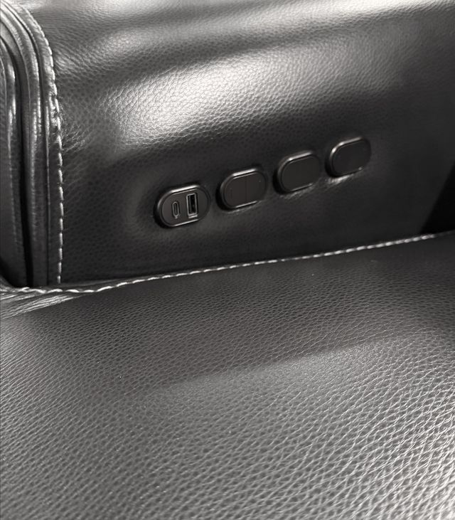 Reclining sectional with built-in charging ports and console