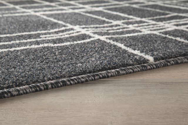 Signature Design by Ashley® Jai Black/White 5' x 7' Medium Area Rug-1