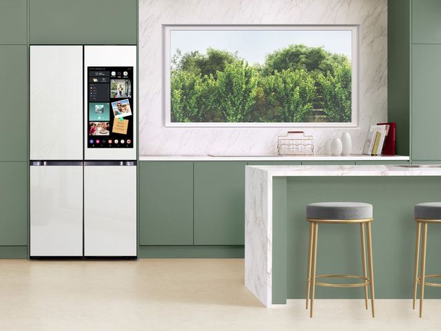 Smart refrigerator with screen in modern kitchen Smart refrigerator with screen in modern kitchen