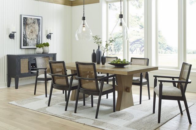 front view of a mid-century modern dining room with a wooden table, and two tone chairs and a matching dining room cabinet