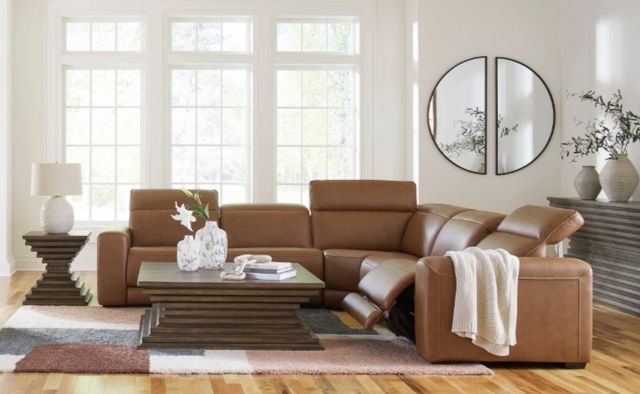 Front view of a modern living room with a leather reclining sectional
