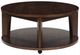Signature Design by Ashley® Korestone Dark Brown Round Cocktail Table-1