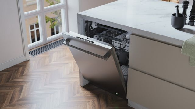 Front view of an ASKO dishwasher in a modern kitchen, slightly opened