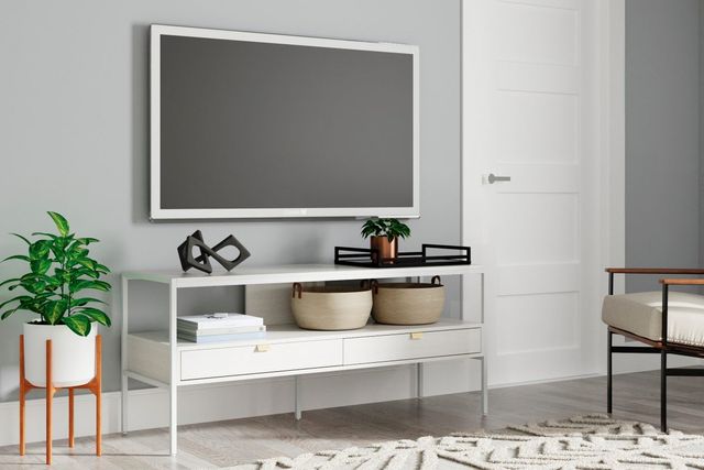 Front view of white minimalist TV console with a white-framed TV mounted above it