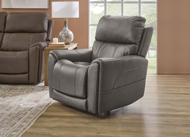 Front view of a Flexsteel Lift recliner in a modern living room with hardwood floors and beige walls.