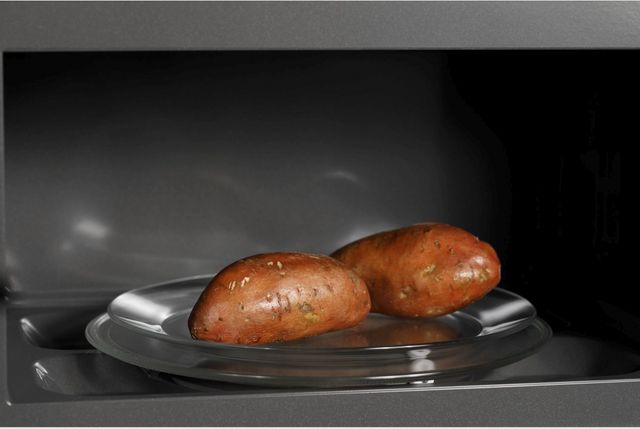 Café™ 2.1 Cu. Ft. Stainless Steel Over The Range Microwave-7
