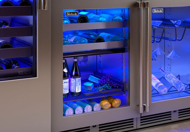 front view of perlick undercounter wine cooler and refrigerator with blue led light and wine bottles and drinks inside