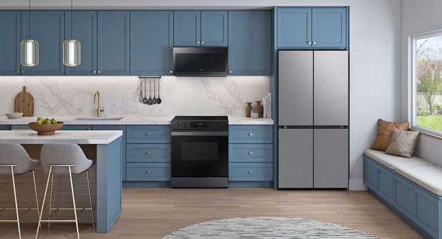 Front view of a modern kitchen with a stainless steel Samsung four door refrigerator