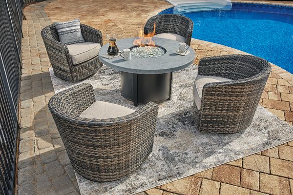 Front view of the Signature Design by Ashley® 5 Piece Coulee Mills Outdoor Set in a modern outdoor space poolside