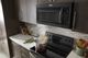 Whirlpool® 1.7 Cu. Ft. Black Over the Range Microwave-5
