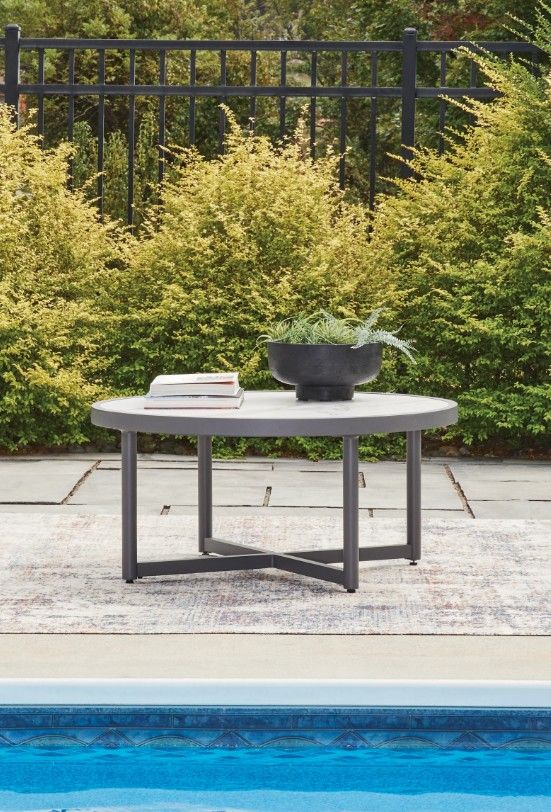 Signature Design by Ashley® North Island Beige Outdoor Cocktail Table with Gray Base-1