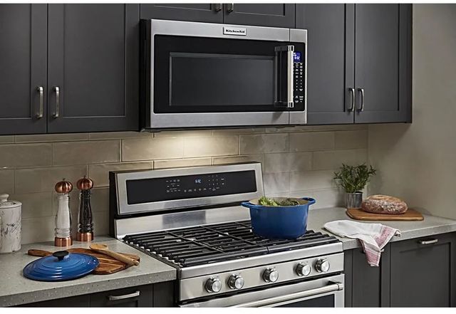 Credit: KitchenAid Front view of a modern kitchen with a KitchenAid over the range microwave