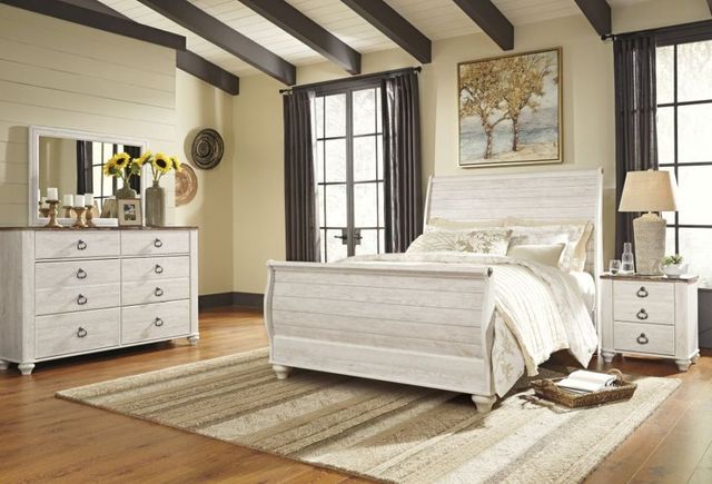 Front view of a modern coastal bedroom with wooden and warm wooden accents