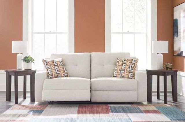 Credit: Signature Design by Ashley Front view of a modern living room with a Signature Design by Ashley reclining loveseat