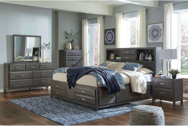 Front view of a modern bedroom with a Signature Design by Ashley storage bedroom set