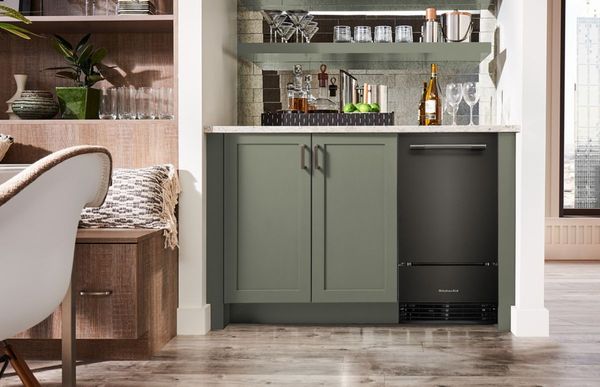 A home bar setup with an ice maker