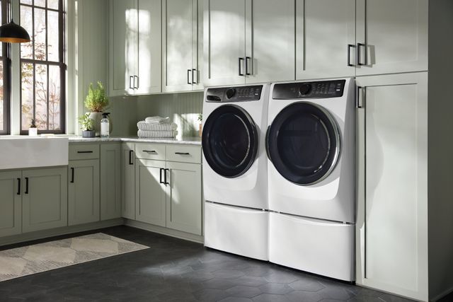 Front view of a modern laundry room with an Electrolux washer and dryer