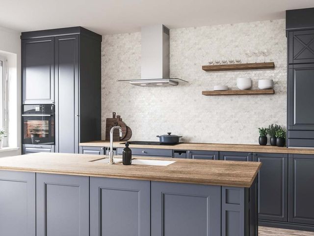 Credit: Zephyr Front view of a modern kitchen with a Zephyr wall mount range hood