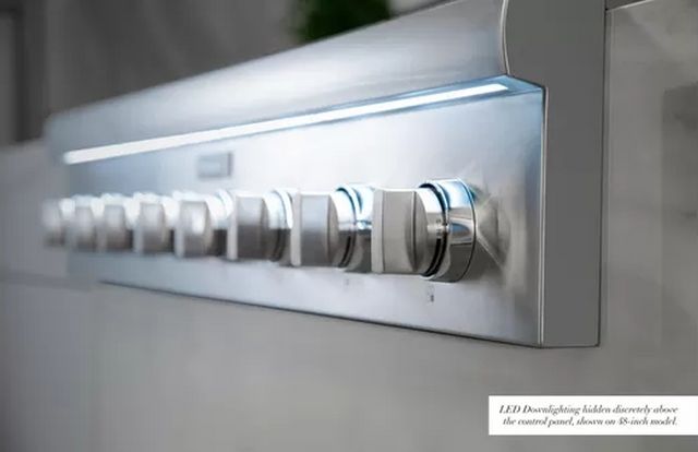 close view of the Thermador range top knobs with LED lighting