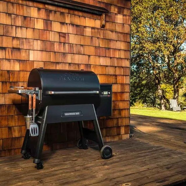 Credit: Traeger Front view of a Traeger Ironwood grill in a modern backyard setting.